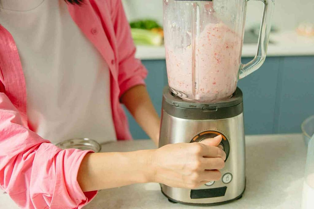 A woman testing blender
